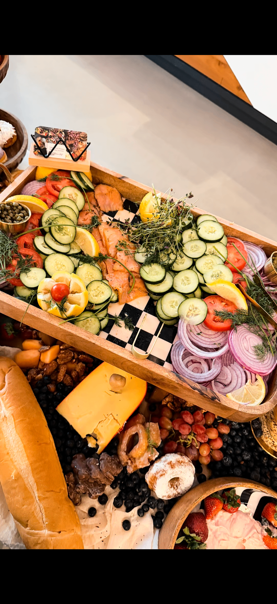 Smoked salmon board with cucumber, capers and dill