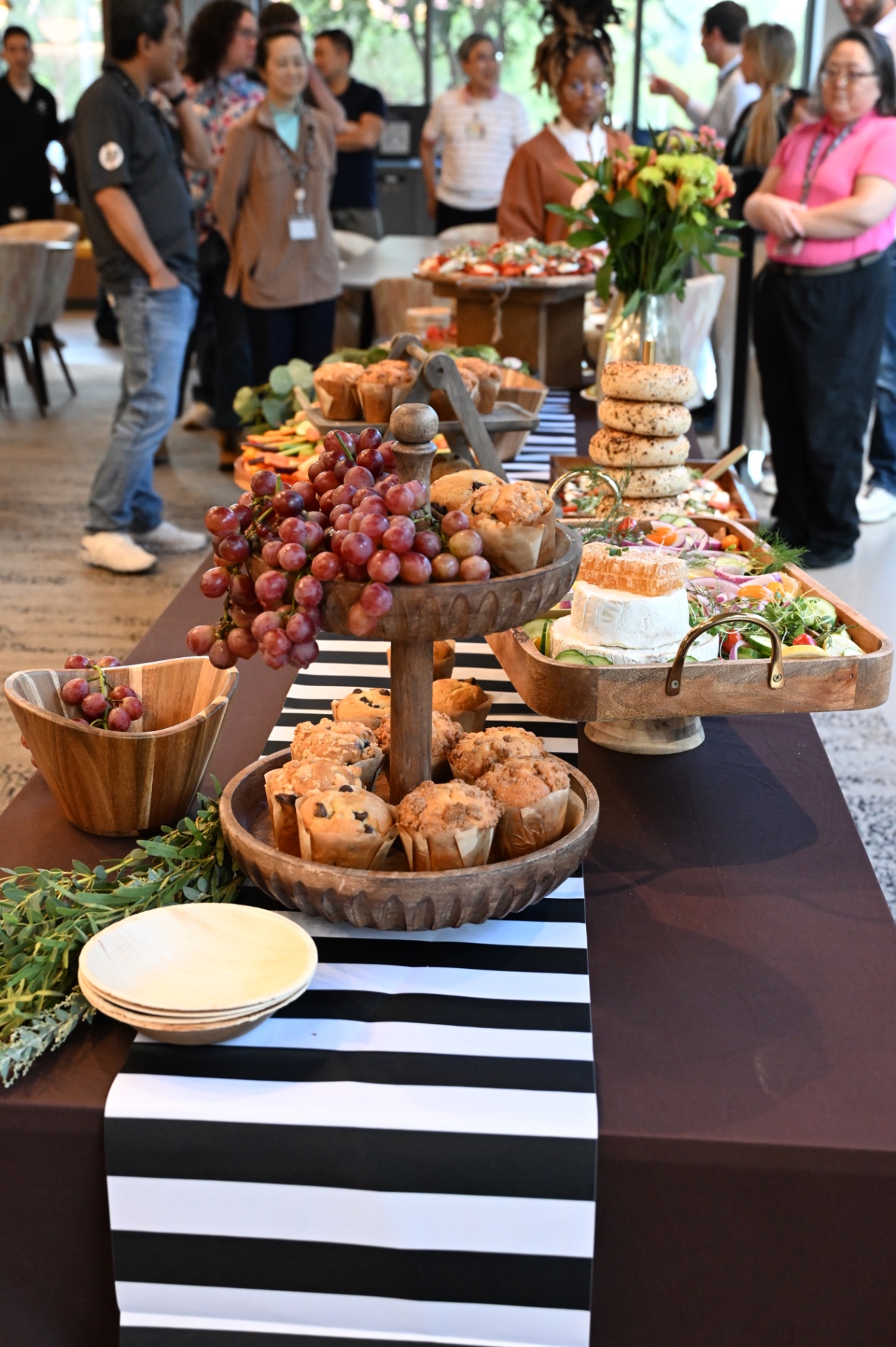 Corporate grazing table with muffins, grapes and bagels