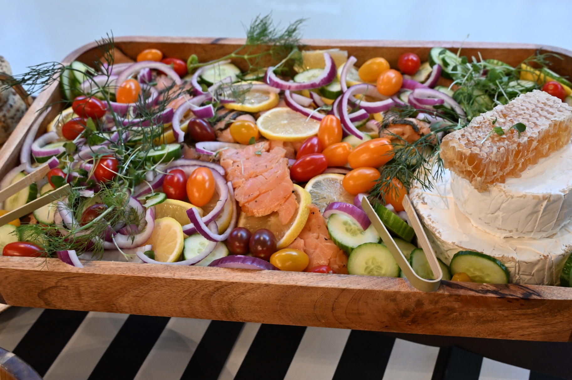 Smoked salmon board with honeycomb, brie and citrus